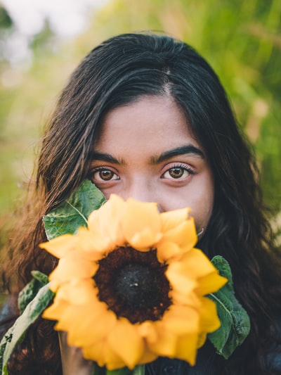 For the woman of the sunflower selective focus on photography
